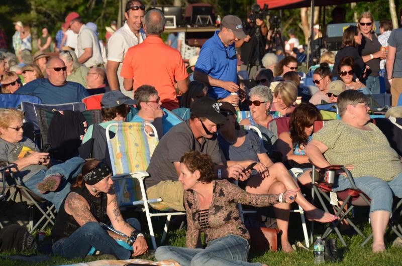 The audience gathered early in the evening to eat a picnic and wait for the show. (Photo by Lynda Clancy)