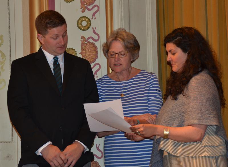 Taylor Benzie and Jenna Lookner read the oath of office, under the direction of Town Meeting Moderator Deb Dodge. (Photo by Lynda Clancy)