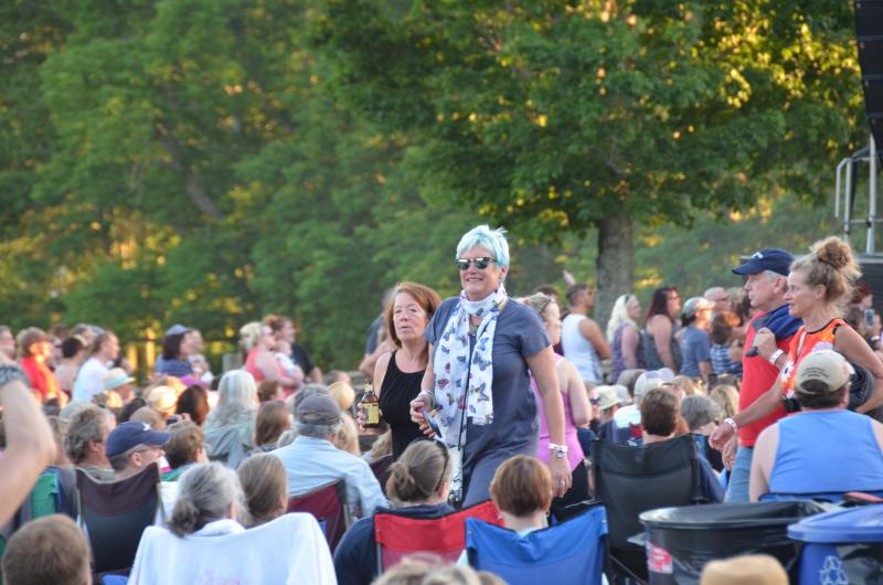 The audience begins to grow as people arrive soon after 5 p.m. (Photo by Lynda Clancy)