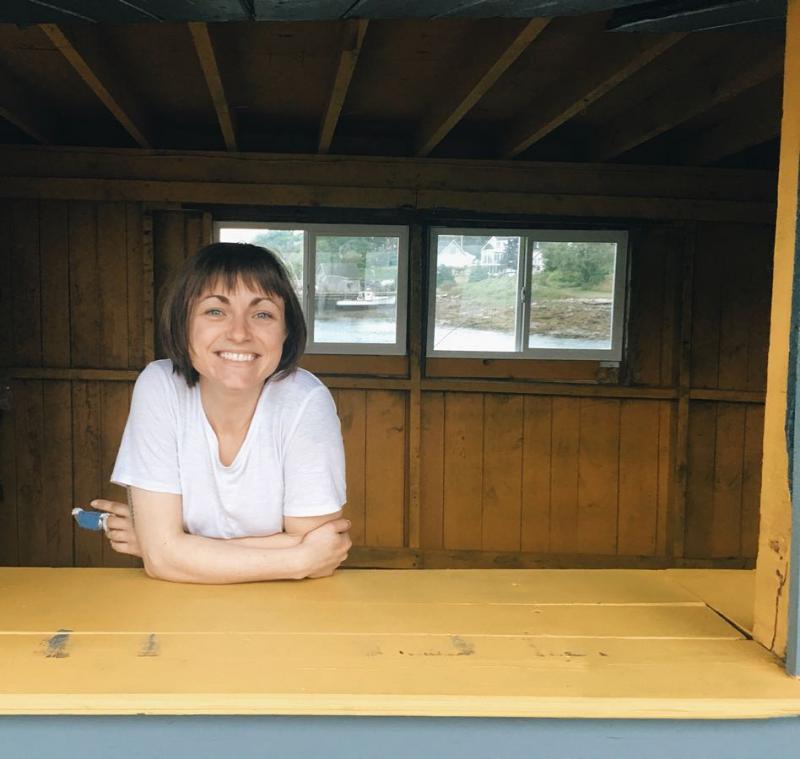 Co-owner of The Salty Owl Erin Armbruster in the window the Lion’s Club’s food shack at the South Thomaston public landing. (Photo courtesy The Salty Owl).