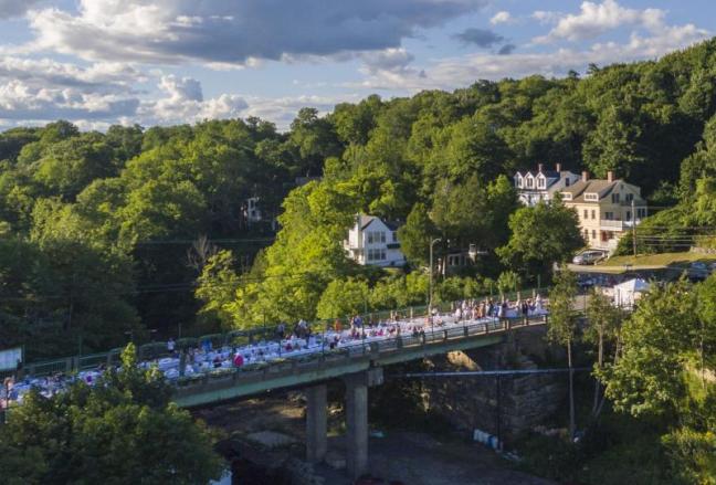 The first-ever Goose River Bridge Dinner was held on the bridge overlooking Rockport Harbor Sunday evening, Aug. 7, 2026. (Photo courtesy Isaac Remsen)