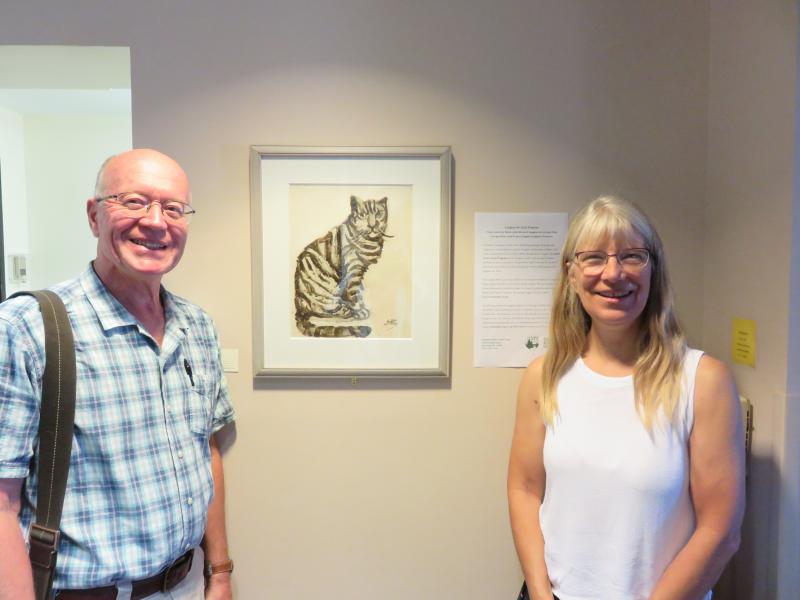 Stephen Cole, Housing Director, MCH, Inc. and Annette Naegel, Director of Conservation, Georges River Land Trust with ink drawing by Bernard Langlais. (Photo courtesy of GRLT)