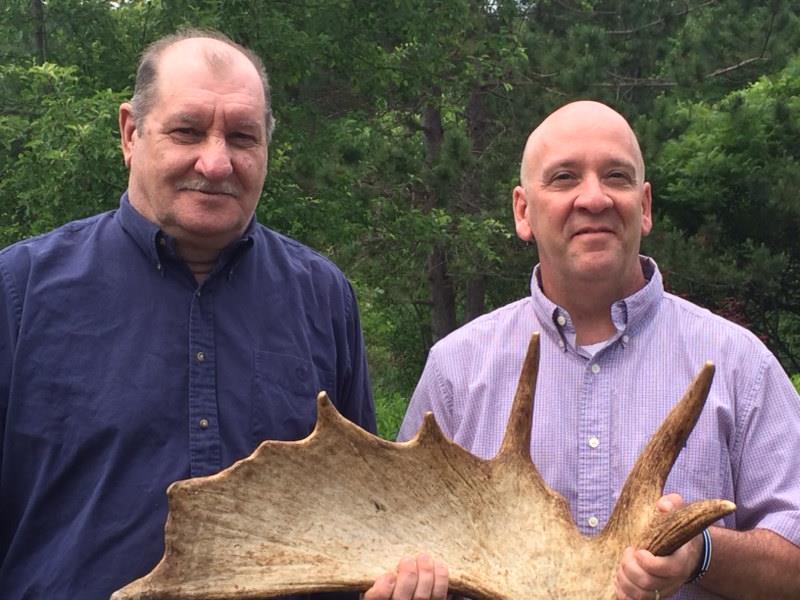 Students brought items to offer at an auction near the end of the 10-week program. Retired Waldo County Sheriff’s Deputy Gene Rego (left) donated a moose shed he had discovered in Maine’s northern woods.