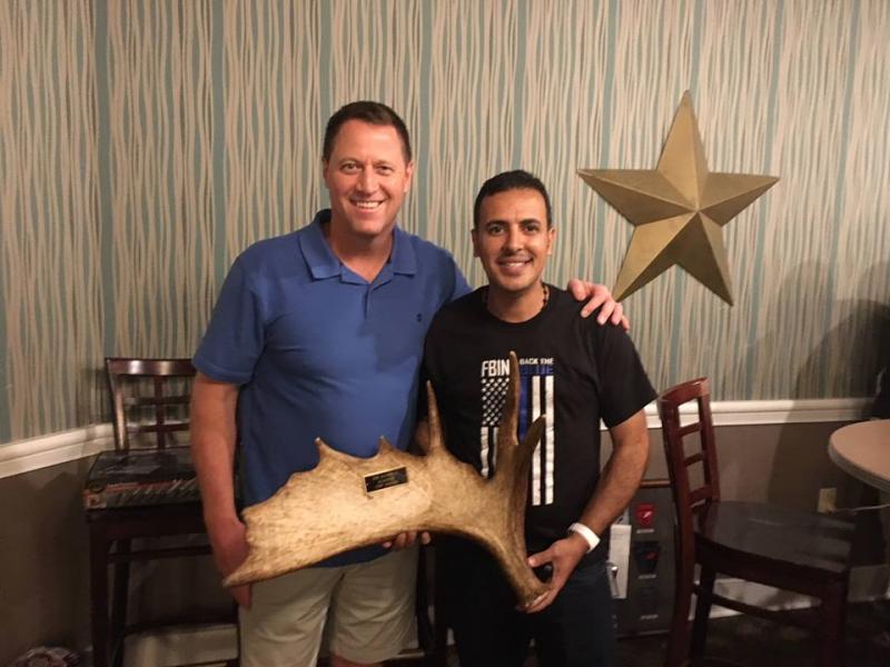 After a bidding war between Rodney Gehrett, of the El-Paso Sheriff’s Office in Colorado, and Mohammed Al-Qarni, of the Kingdom of Saudi Arabia. Al-Qarni ended up winning the item for $420. The over $30,000 raised by the auction will be split between three charities: Concerns of Police Survivors, Pink Patch Project, and 10-99 Foundation. (photo courtesy of Chief Deputy Trundy)
