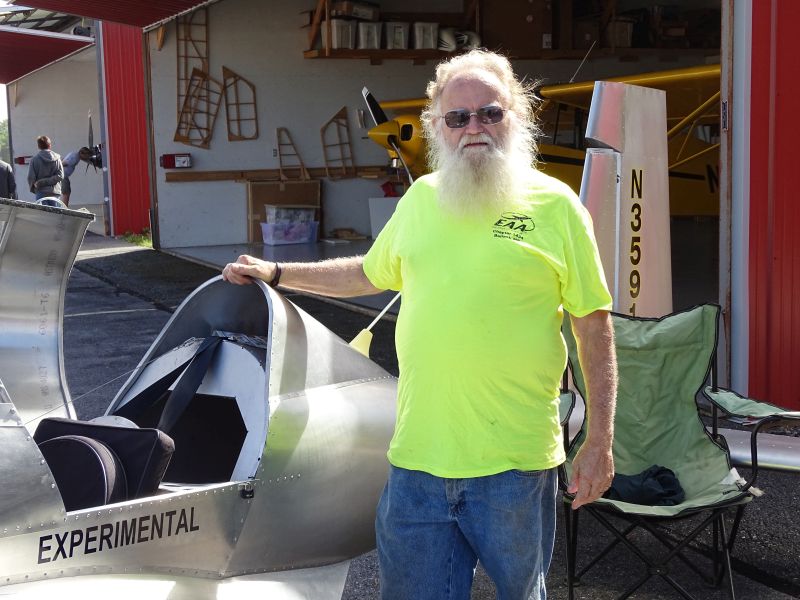 Robert Dodge poses with his homemade aircraft. (photo by Erica Thoms)