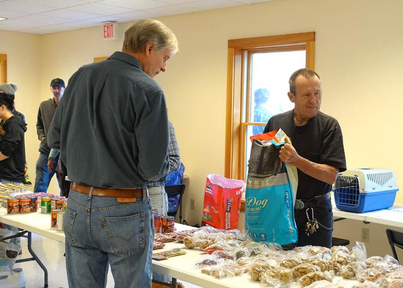 Volunteers assembling pet food bags. (Photo courtesy of the Penobscot Pet Pantry)