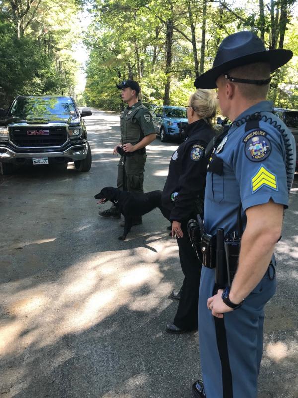 From left to right is Game Warden Lucas Bellanceau and K9 Breezy, Trooper Detective Abby Chabot and Trooper Sergeant Chris Farley during a search effort near Westra’s Lufkin Road home yesterday. (photo courtesy of the Maine Warden Service)