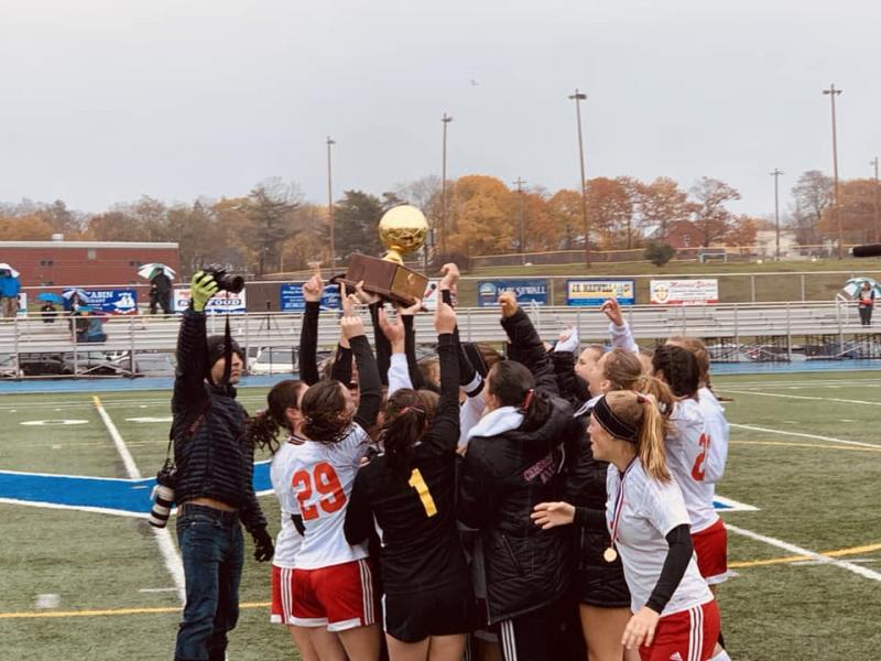 Camden Hills celebrating its third consecutive state championship. (Courtesy Steve Alex)