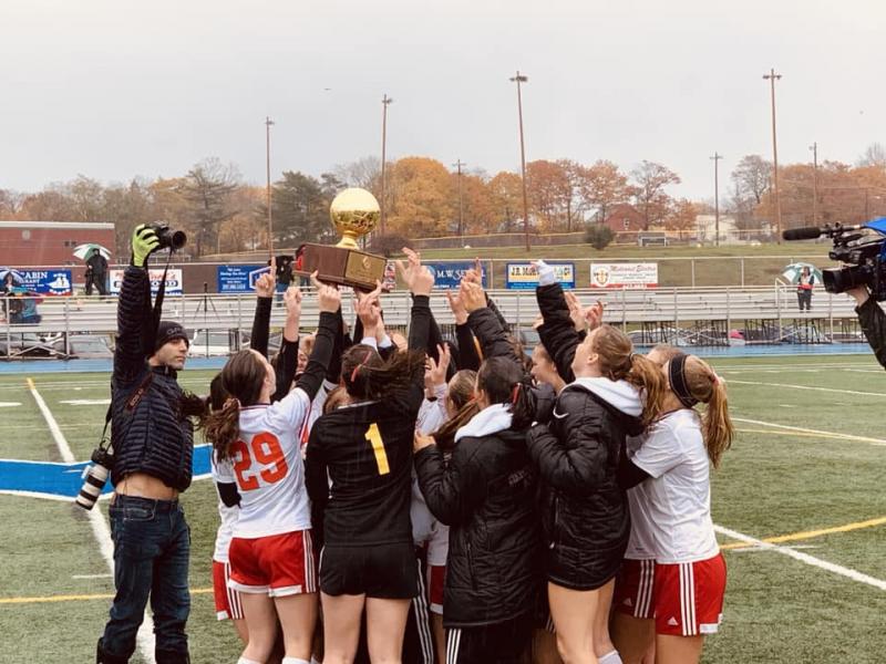 Camden Hills celebrating its third consecutive state championship. (Courtesy Steve Alex)