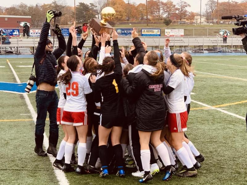 Camden Hills celebrating its third consecutive state championship. (Courtesy Steve Alex)