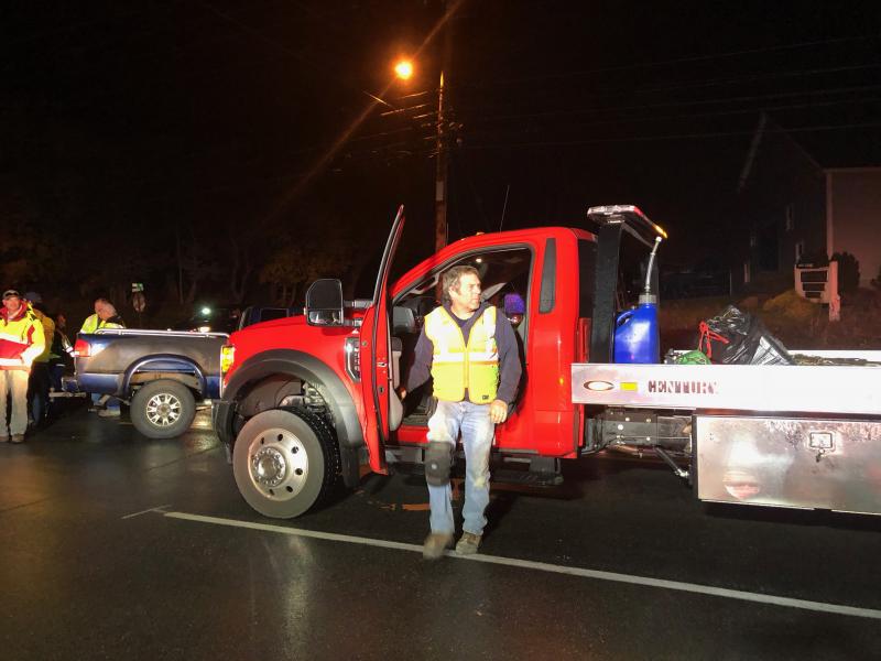 Steve Laite, owner of Camden Exxon, arrives to get the vehicles hauled off the road. (Photo by Lynda Clancy)