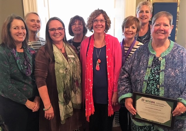 New Hope for Women’s board of directors celebrate Kathleen Morgan’s Champion of Change award from Maine Coalition to End Domestic Violence. (L to R) Diane Norton, Pat Aboud, Francine Garland Stark of MCEDV, Cyndi Ostrowski, Anne Conners, Sue Norton, Vera Roberts, and Kathleen Morgan. (Photo courtesy of New Hope for Women)
