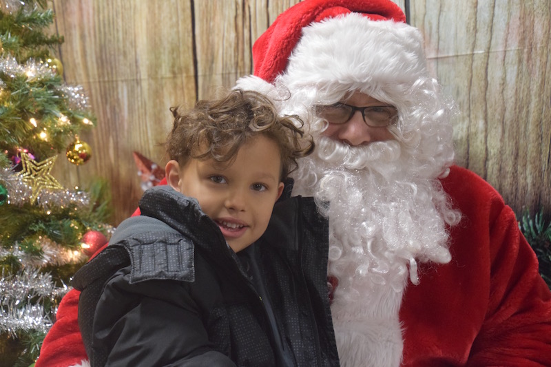 Legare Cuyler sits with Santa Clause during a school children’s shopping trip. (Photo courtesy of Thomaston Grammar School)