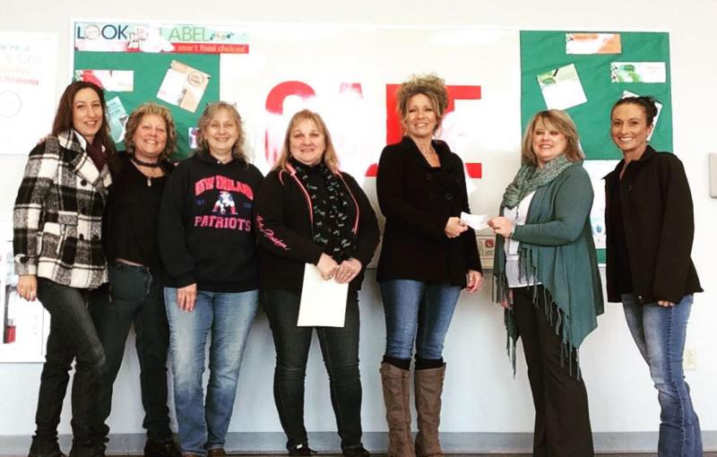 Jen Wenz delivers a $500 donation from Hamilton Marine to clear the lunch account balances at Mt. View School in Thorndike. L to R: Regina Quattrucci, Amy Mehurine, Susan Totman, Pamela Schultz, Jen Wenz, Tina Fabian, ND., Davine Bussell, ( Missing from Photo is Team Member Tammi Short)(Photos courtesy Jen Wenz)
