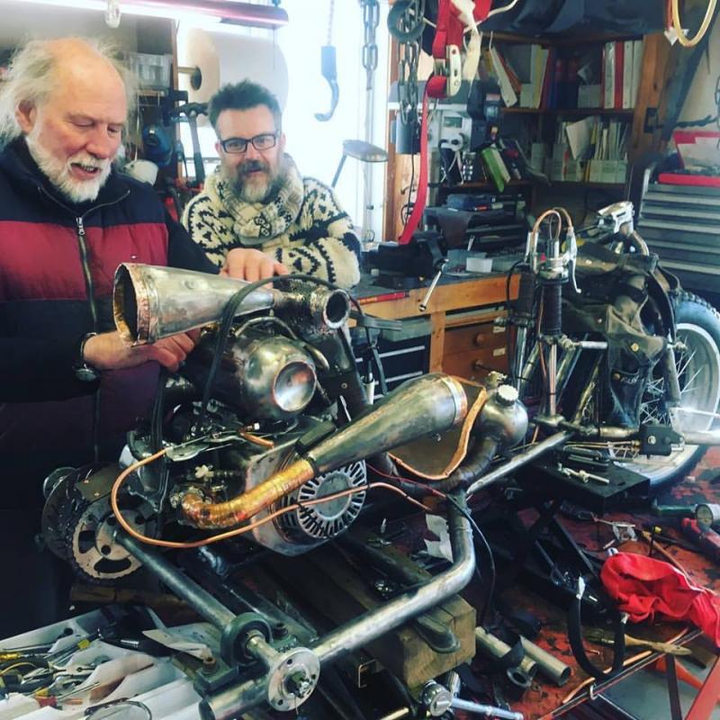 Jack Churchill and Jim Hamilton in Jack;s shop with a motorcycle. (Photo courtesy of Jack Churchill)