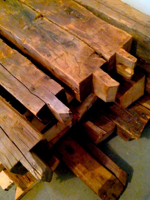 A stack of 170-year-old King’s Pine timbers in Thad Chilton’s workshop prior to being used in the guitar making process. (Courtesy Thad Chilton)