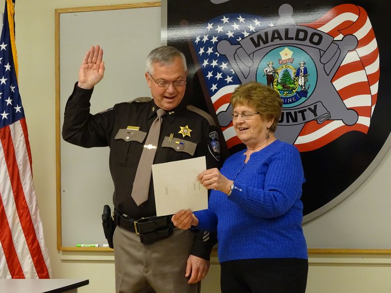 Sheriff Jeffrey Trafton is sworn-in for his second term as sheriff with Irene Blood, who worked with District Court for 30 years before retiring. (photo by Erica Thoms)