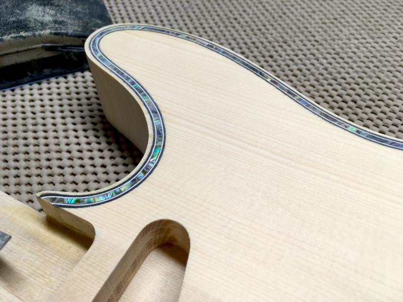A Northwoods guitar undergoes a final sanding during the guitar making process. (Courtesy Thad Chilton)