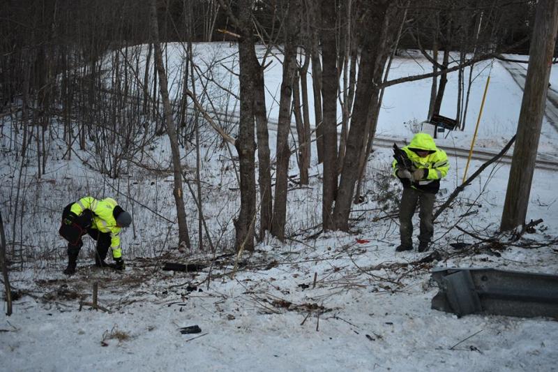 Rockport firefighters pick up the debris in the wooded area off of Route 1 following the crash. (Photo courtesy of Rockport Fire Department)