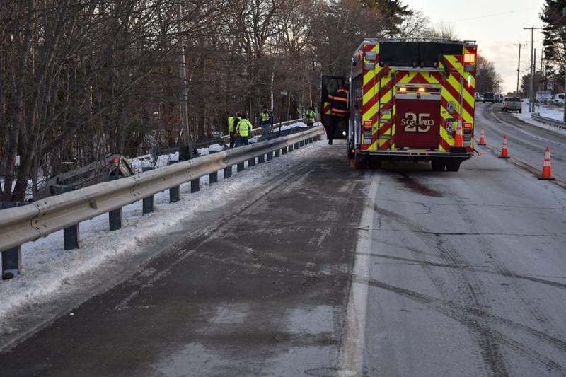 A rollover crash on Commercial Street (Route 1) Jan. 31, backed up traffic in both directions as the Rockport Fire Department and Camden Exxon worked in tandem to remove a vehicle that crashed in the woods. (Photo courtesy of the Rockport Fire Department)