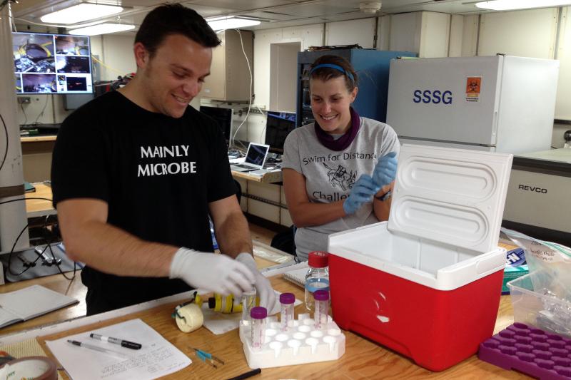 Study author Stephanie Carr works with a student to process deep-sea samples aboard the R/V Atlantis. A recent study found that
a group of unusual microbes living below the seafloor provides clues to the evolution of life on Earth, and potentially other planets. Courtesy of Beth Orcutt/Bigelow Laboratory for Ocean Sciences