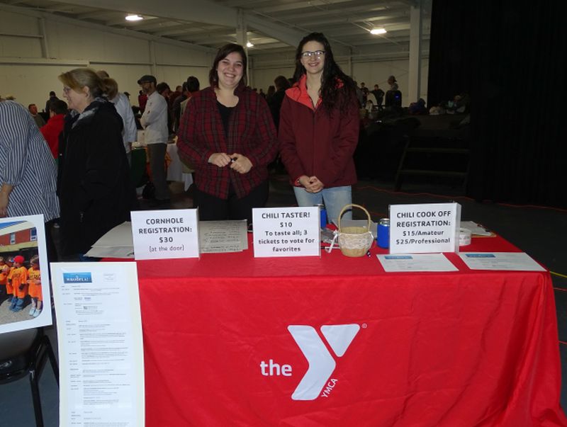 Carolyn Steeves (left) and Eryn Thostenson (right) man the entry booth for the Waldo County YMCA. Paul Abbott said he uses three types of meat and three types of peppers in his chili. (photo by Erica Thoms)