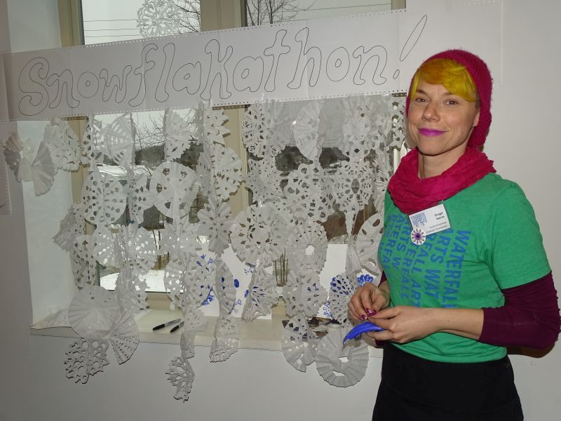 Bridget Matros, of Waterfall Arts, said she was hoping to get 100 snowflakes created, a feat she had accomplished by early Saturday afternoon. (photo by Erica Thoms)