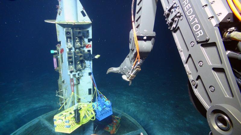 Scientists use the deep-diving robot Jason to collect water samples from oceanic crust at a subseafloor observatory off the coast of Washington. A recent study found that a group of unusual microbes living below the seafloor provides clues to the evolution of life on Earth, and potentially other planets. Courtesy of Woods Hole Oceanographic Institution, courtesy of University of California, Santa Cruz, U.S. National Science Foundation, ROV Jason dive J2-711, 2013, AT26-03 cruise chief scientist Andrew Fisher