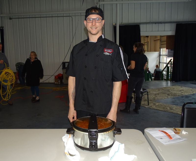 Jake Grass represented Delvinos in the competition and said their chili has “more of a Caribbean flair,” with jerk seasoning and pork. (photo by Erica Thoms)