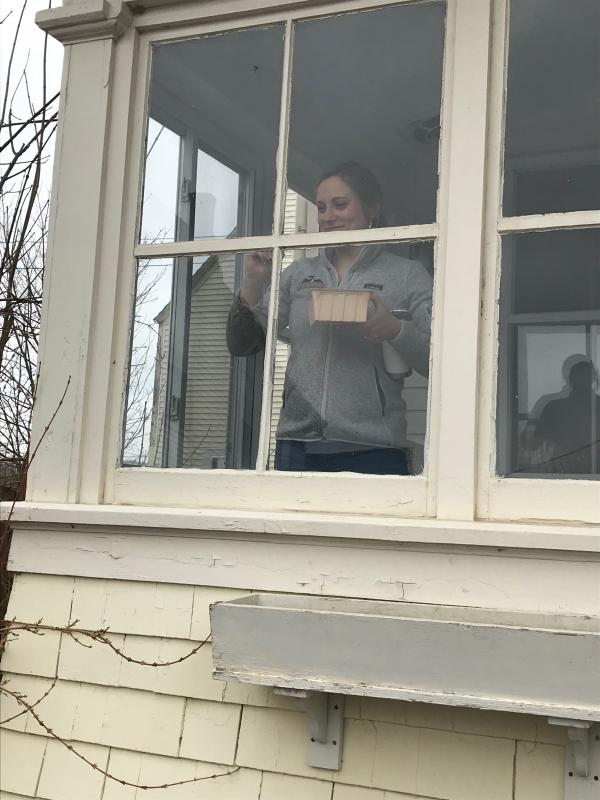 Jillian Lary working on painting in the day porch area of the Sterlingtown Public House. (Photo by Jenna Lookner)