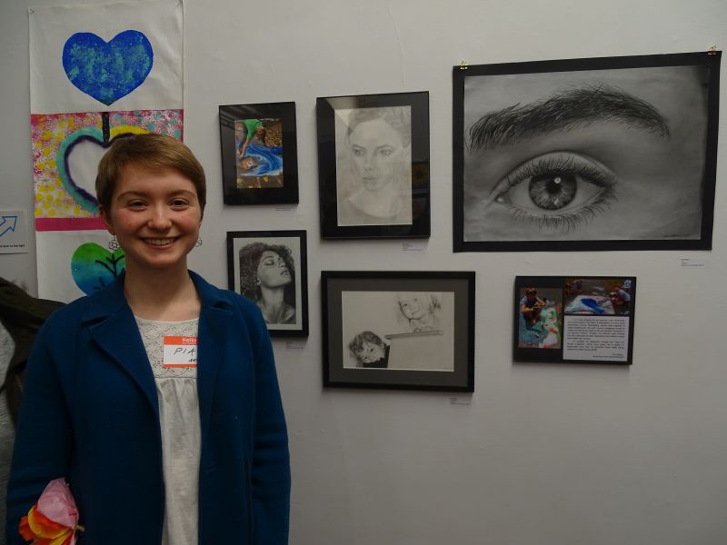 Gibson stands in front of her artwork. (photo by Erica Thoms)