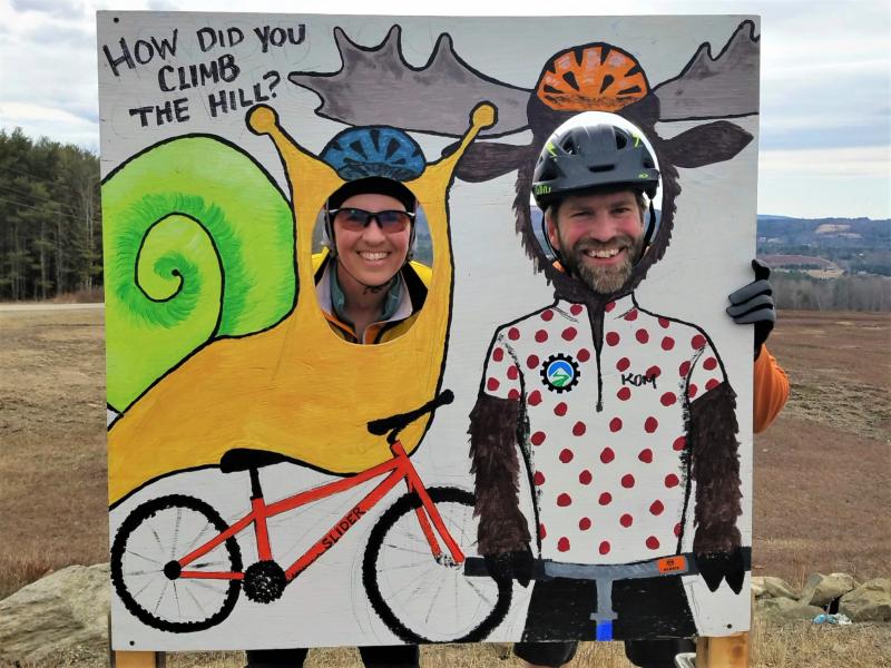 Safety crew volunteers Meredith Currier and Darby Urey stop at a photo booth at the top of a ridge. (Photo courtesy Stacey Keefer)