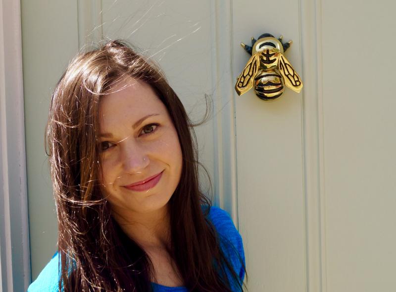 Amanda Amoroso in front of her studio door and its bee knocker. (Courtesy Amanda Amoroso)