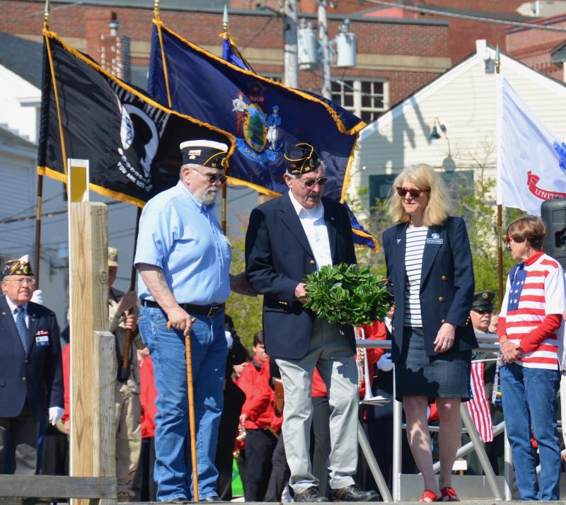 Tossing the commemorative wreath into Camden Harbor. (Photo by Lynda Clancy)