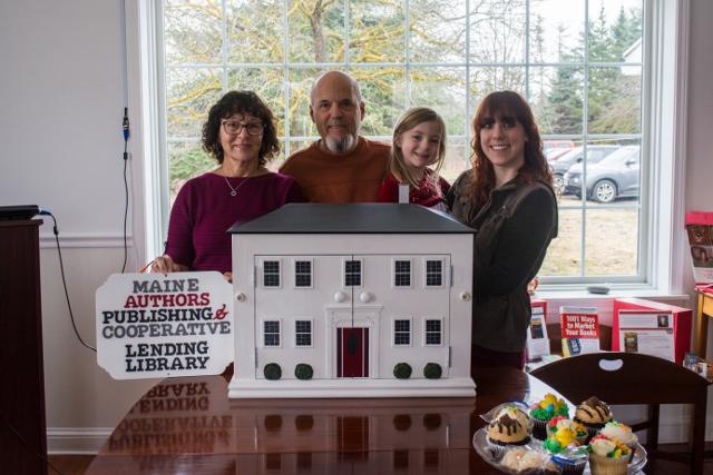 From left to right: Susan Cueto, Joseph Cueto, Alexandria Brackett, and Michelle Hodgdon present the library to Maine Authors Publishing. (Photo courtesy Maine Authors Publishing)