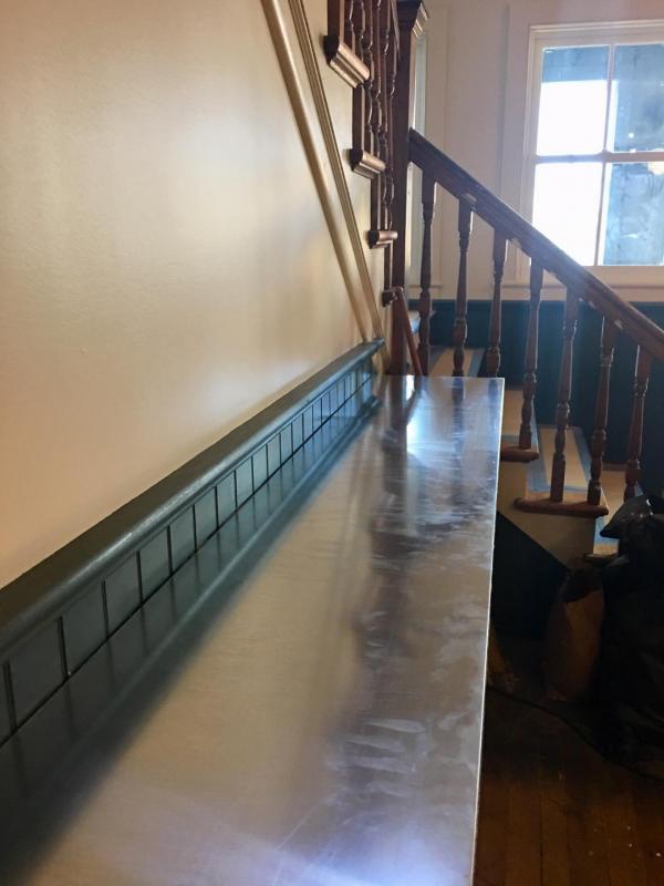 A zinc bar top with revive a patina. (Courtesy Kris Davidson)