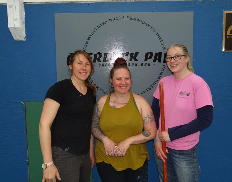 Project Manager Heather Q. Hay (center) and fellow volunteer Allison Harrell (right) pose with another volunteer in front of the new park sign. (photo by Erica Thoms)