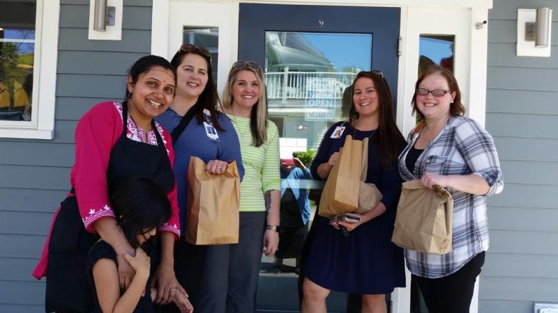 Dee Patel’s coworkers at Pen Bay Skin Care in Rockport took several takeout bags back to their office on opening day, June 7. (Photo by Sarah Shepherd)