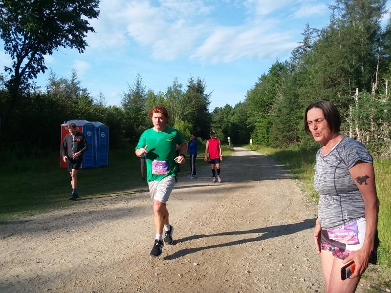 Brendan Riordan approaches a transition point as Laura Buxbuam looks on. (Photo by Sarah Thompson)