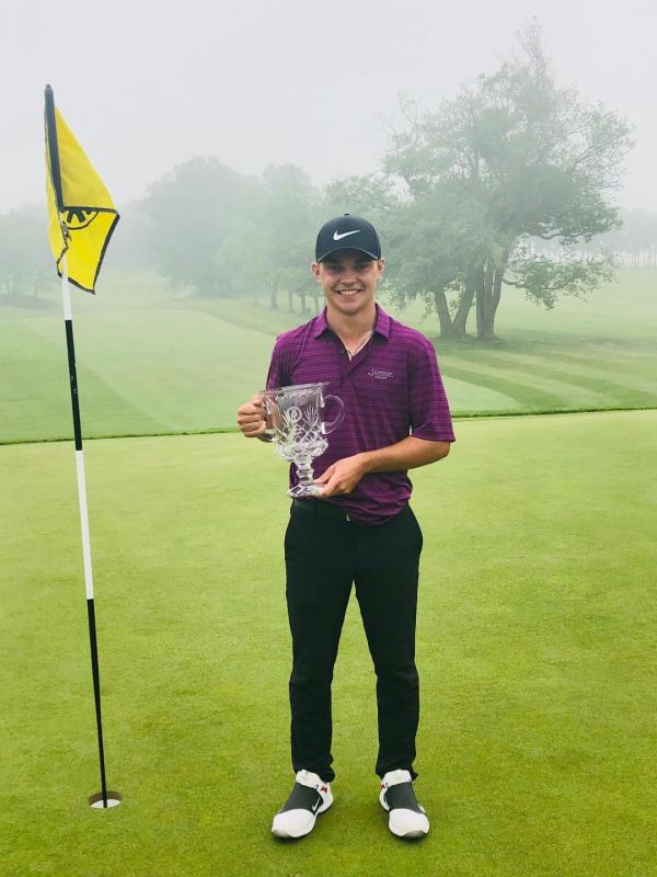 Cole Anderson with his 100th Maine Amateur Championship trophy.