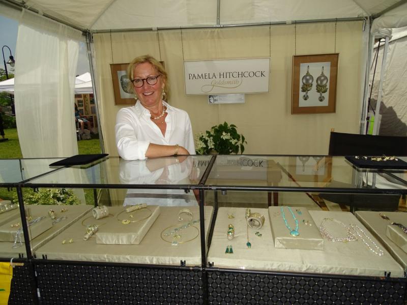 Pamela Hitchcock poses with her handmade jewelry.