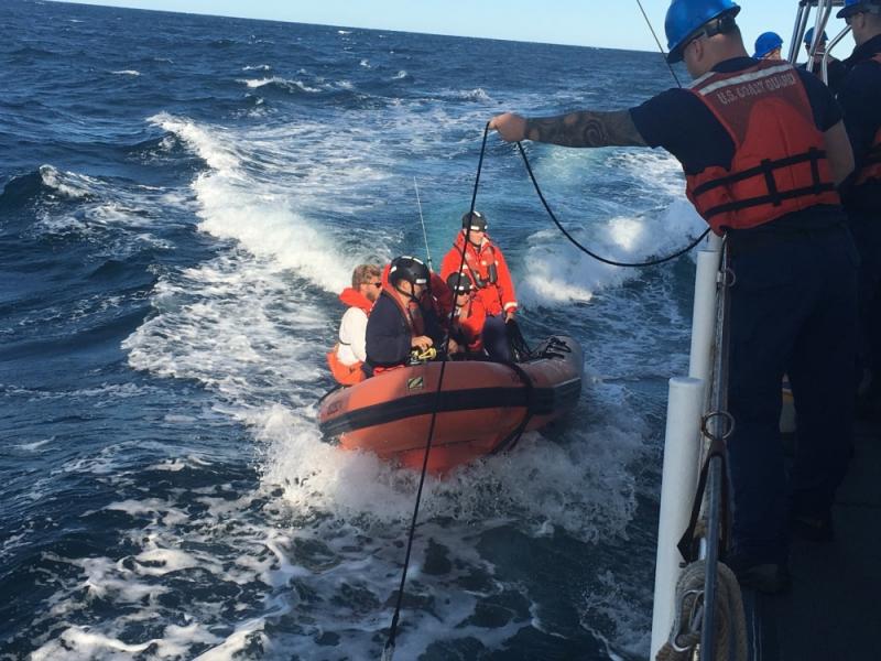 Coast Guard Cutter Ocracoke's small boat crew returns to the cutter after rescuing two boaters off the coast of Maine, Sunday, Aug. 11, 2019, near Cashes Ledge. The wife of one of the boaters reported her husband missing to Coast Guard Sector Northern New England the previous night. (U.S. Coast Guard photo by Seaman Michael Neo)