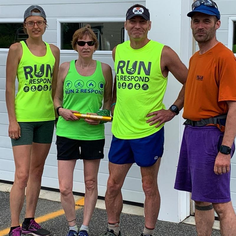 Frances Killea and Theresa Withee hand over the baton in Warren. (Photo courtesy Run2Respond)
