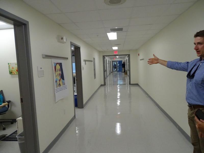 An updated hallway in the school is shown by VP Colden Golann. (photo by Erica Thoms)