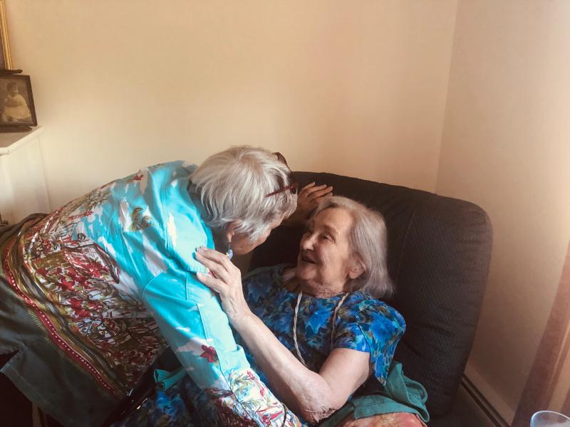 Elizabeth Beale-Clancy greets her sister, Garie Perry, July 23, 2019.