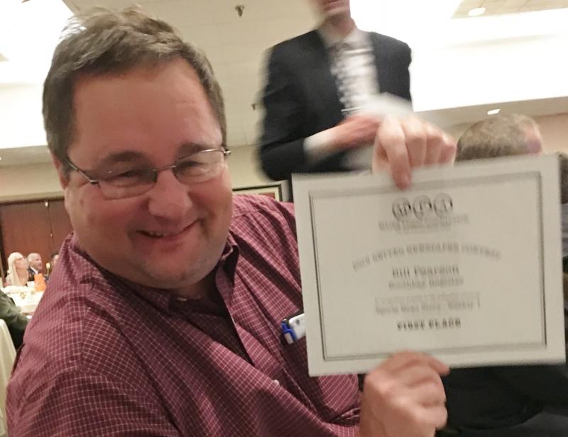 Reporter Bill Pearson holds the first place certificate for his Sports Story. KEVIN BURNHAM/Boothbay Register