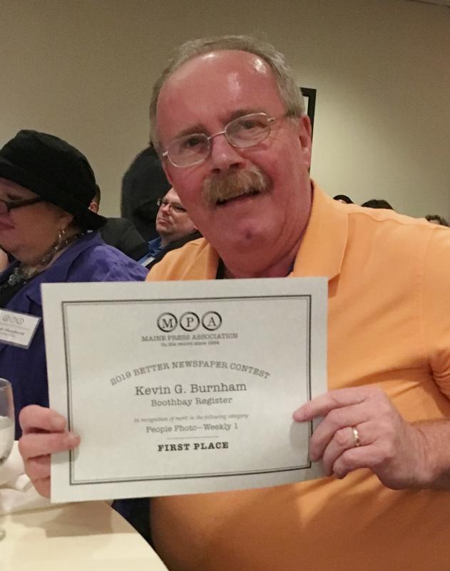 Editor Kevin Burnham holds the certificate for his first place People Photo. STEVE EDWARDS/Boothbay Register