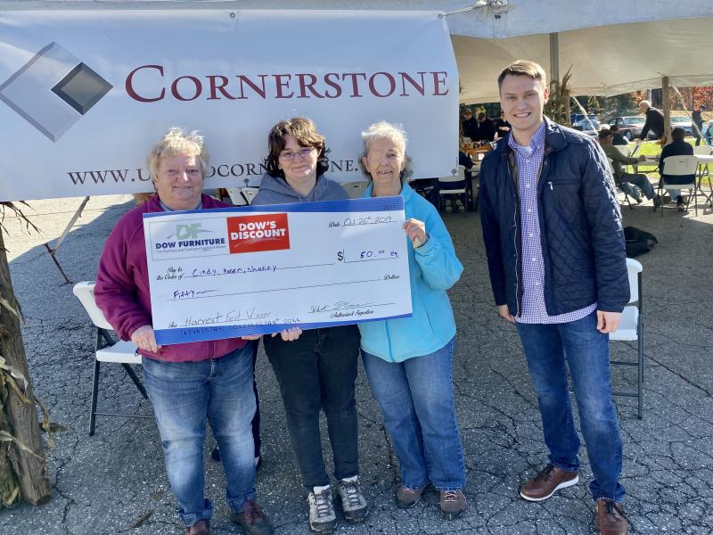 Winners of the Cornhole tournament: Cindy, Karen, and Sharity stand with Wilmot Dow of Dow Furniture. (Photo courtesy Dow Furniture)