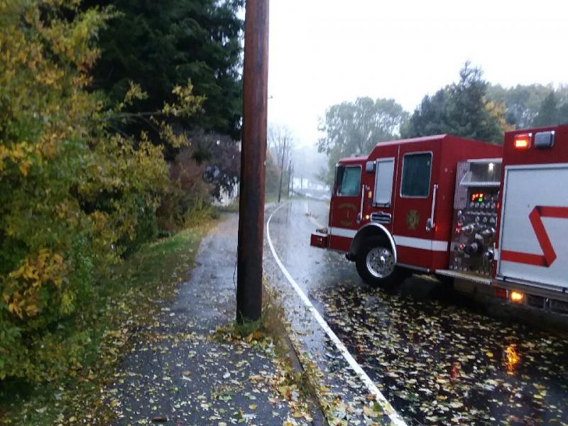 A Thomaston crew sat in a fire truck at Wadsworth Street to keep residents clear of the powerlines. (Photo by Sarah Thompson)