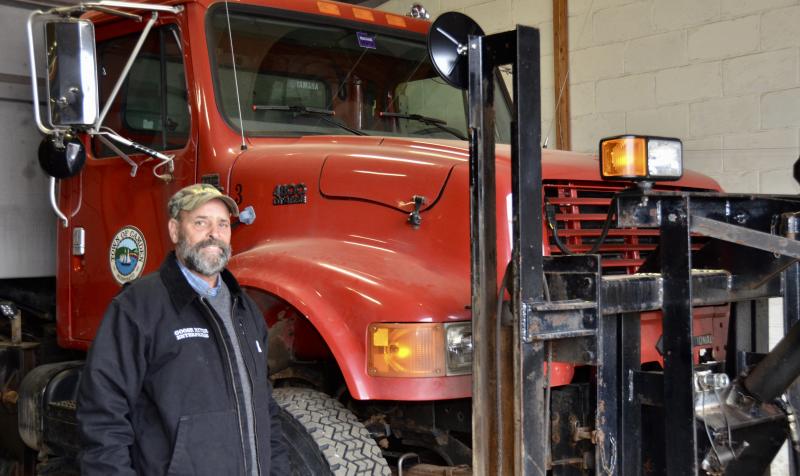 Keryn Annis and Truck No. 3, the one he drove for years, plowing snow up and down the hills of outer Camden. (Photo by Lynda Clancy)